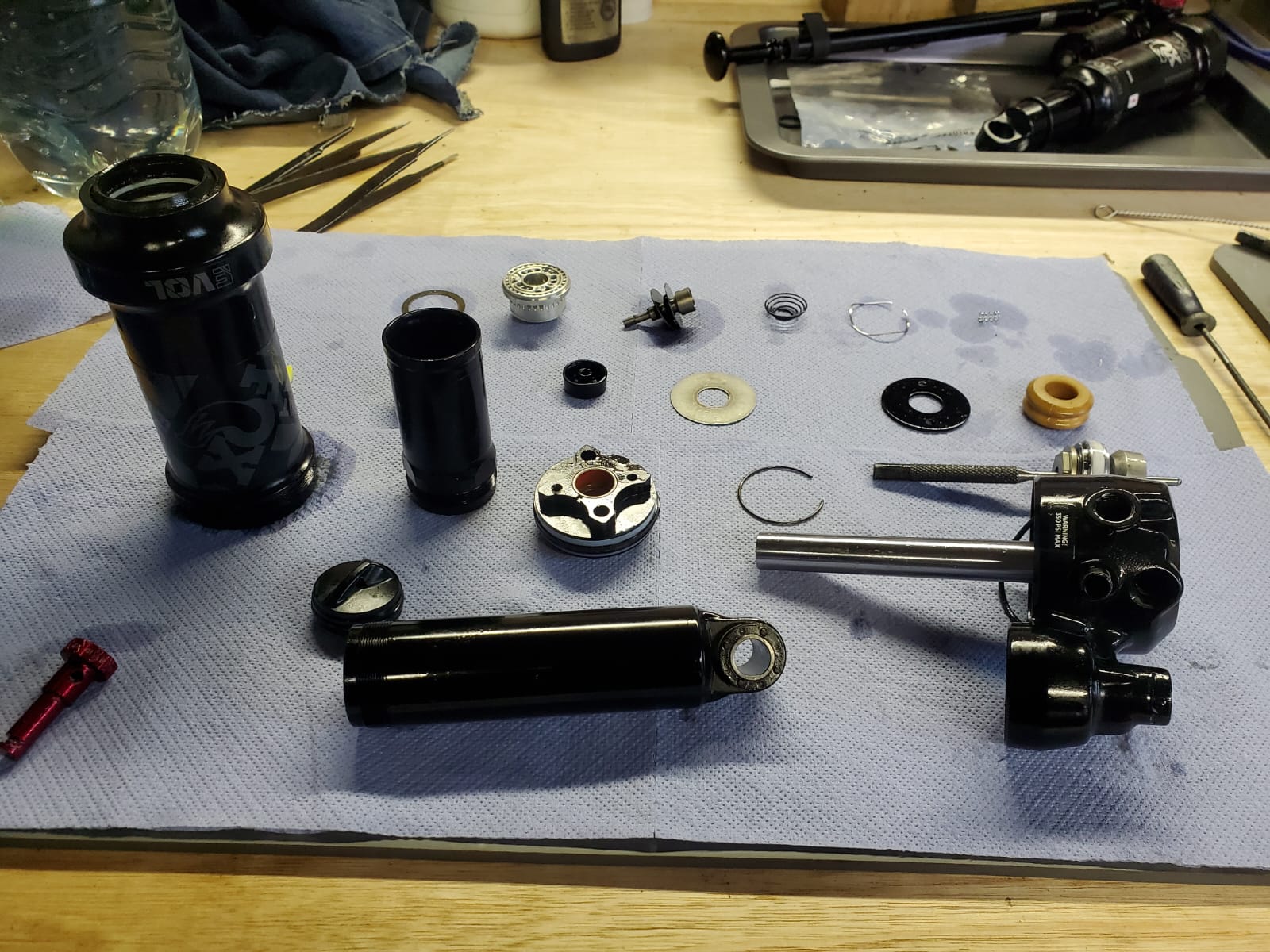 Complete rear shock disassembly showing all components